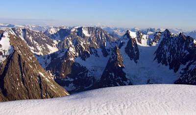 Jagged Lyngen Alps seen covered in snow.