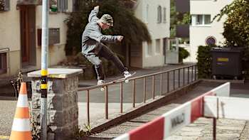 Swiss skater Sven Kilchenmann front boards a local railing in Zurich, Switzerland