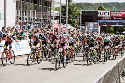Riders move away from the start line of an XCC World Cup race in Albstadt, Germany