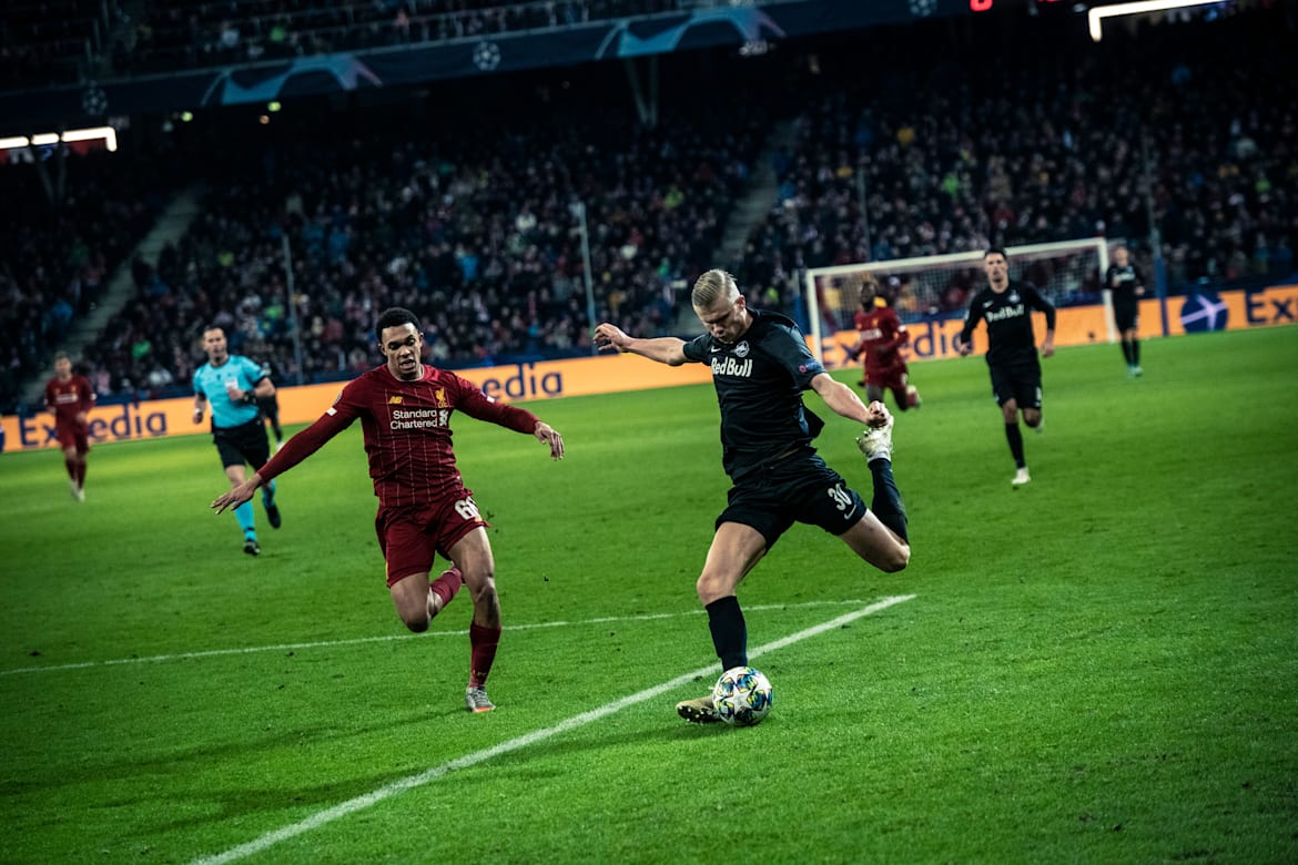 Trent Alexander-Arnold and Norway's Erling Haaland in the heat of a match.