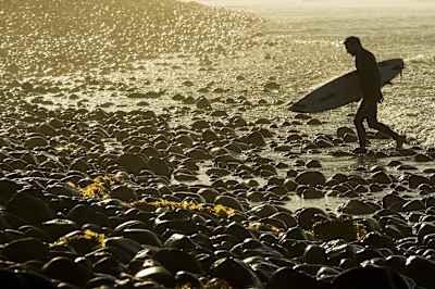 Rock dancing is part of the Trestles experience Joel Parkinson exits the water at Lowers Trestles's right.