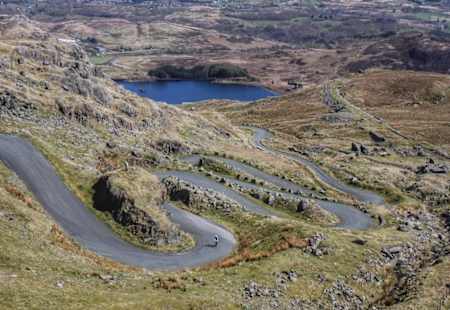 A series of switchbacks on a road climb.
