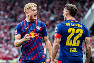RB Leipzig new signing Conrad Harder celebrates with captain David Raum.