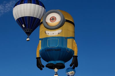 A Minion shaped balloon takes to the skies on the first day of the Bristol International Balloon Fiesta at the Ashton Court est