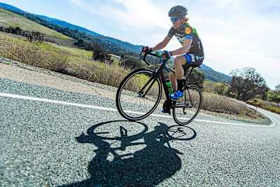 Torey Philipp rides his bike up hill