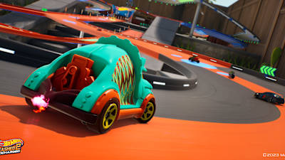 Screenshot aus Hot Wheels Unleashed 2 zeigt ein Rennen mit einem Dinosaurier-Auto.