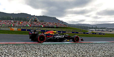 Screenshot aus F1 25 zeigt den Red Bull Boliden vor dem Stählernen Bullen am Red Bull Ring.