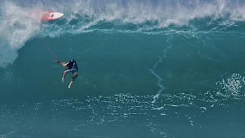 Local surfer Jamie O'Brien wipes out at Pipeline break on Haleiwa, Oahu, Hawaii