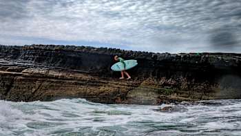 Jamie O'Brien walks out to do a bomb drop in Australia, on May 01 2019.