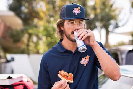 Kris Bryant eating pizza before the prank on fans