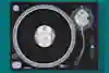 An illustration of a 12-inch copy of Rhythim Is Rhythim's Strings Of Life on a record player.