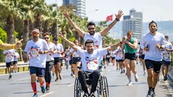 Participants perform during the Wings for Life World Run Flagship Run in Izmir, Turkey on May 8, 2022.