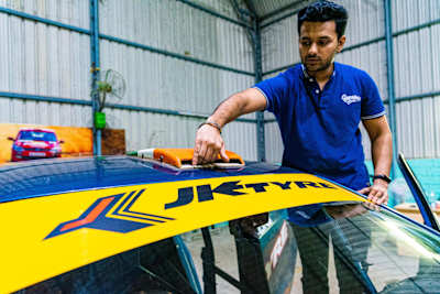Dean Mascarenhas displays the air scoops on the roof of his rally car