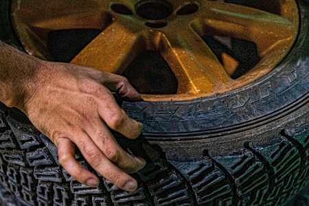 Dean Mascarenhas displays the tyres on his rally car
