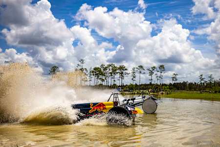 Formula One drivers experience swamp buggy racing in Florida.