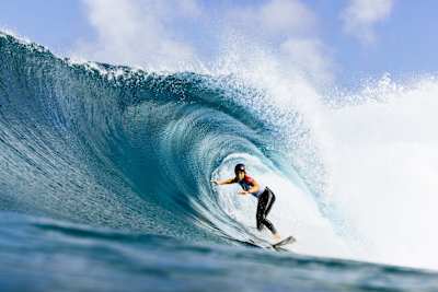 Molly Picklum surfing at the Billabong Pro Pipeline in Hawaii. 