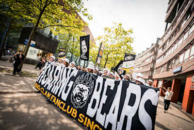 The Big Clan Fanclub gather behind their banner on the streets of Cologne during the Intel Extreme Masters tournament in 2025.