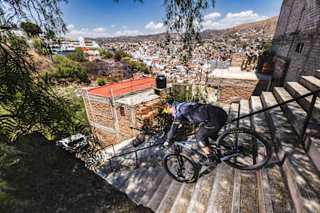 Tomas Slavik performs at an urban downhill race in Mexico.