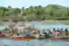 The race's start is pure bedlam as 66 teams scramble into outrigger canoes and fight rush-hour traffic as they head toward the sea.