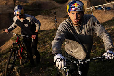 Mountain bikers Gee Atherton and Matt Jones riding some dirt jump trails