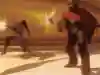 A screenshot of the McCree and Widowmaker characters from the Overwatch video game