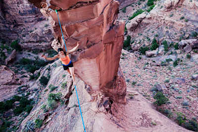 Emily Sukiennik highlining between an arch