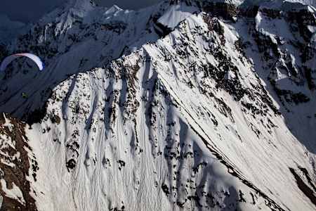 Spanish Red Bull athlete Horacio Llorens flies high above Rakapohsi (7788m) in Hunza Valley in northern Pakistan.