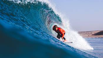 Carissa Moore does a layback while surfing in Morocco.