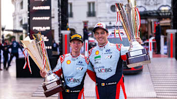 Thierry Neuville and Martijn Wydaeghe celebrate Hyundai Shell Mobis World Rally Team's first place win at the 2024 World Rally Championship podium in Monte Carlo, Monaco