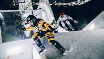 Richie Velasquez of the United States and Filipe Carvalheiro of Switzerland compete during the Juniors Championship at the Red Bull Crashed Ice in Yokohama, Japan on December 7, 2018.