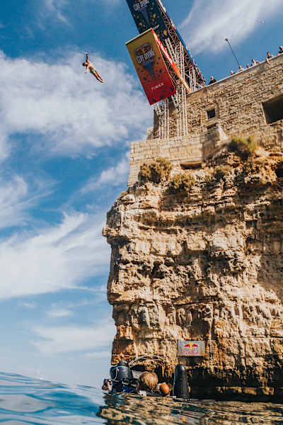 Steven LoBue is filmed by Max Struck as he dives from the 27m platform at the final stop of the Red Bull Cliff Diving World Series in Polignano a Mare, Italy on September 23, 2018.