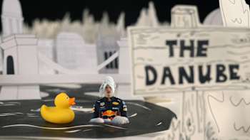 A still image of Max Verstappen taking a bath in the Danube taken from an animated guide to Hungary's Hungaroring circuit.
