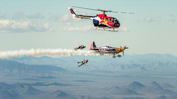 Jon DeVore and Luke Aikins jump from a helicopter