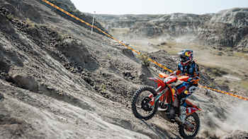 Trystan Hart of KTM Enduro Factory Racing tackles a steep climb at Red Bull Outliers 2025 in Steveville, Alberta, showcasing fearless precision in the Canadian Badlands