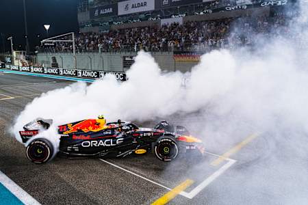 Oracle Red Bull Racing's Sergio Pérez celebrates a third place finish at the 2022 Abu Dhabi F1 Grand Prix.