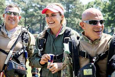 Thompson and SEAL companions after skydiving to a May 2017 pro tournament.