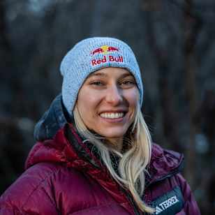 Red Bull athlete Janja Garnbret sports a Red Bull beanie and outdoor gear in Ticino, Switzerland, during a crisp autumn day in November 2025.