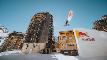 Valentin Delluc speedriding on a kicker in the deserted ski resort of Avoriaz, France.
