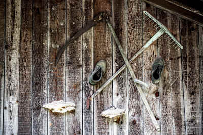 Old tools hung on a wall in Südtirol.