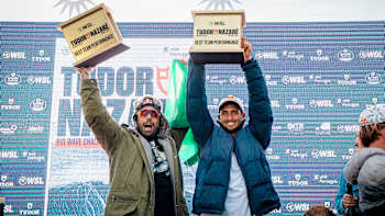 Lucas Chianca and Pedro Scooby celebrate their Best Team Performance win on the podium at the WSL Big Wave Tour in Nazaré, Portugal, on January 22, 2024, with Red Bull spirit