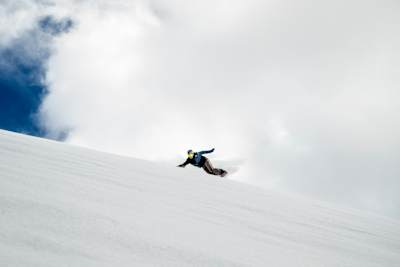 Snowboarder Lyon Farrell riding at Mauna Kea
