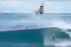 Surfer Filipe Toledo does a big air on the North Shore of Oahu, Hawaii