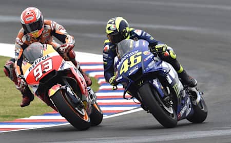 Marc Márquez duels with Valentino Rossi at the 2018 Argentine Grand Prix. The Spaniard and Italian sit atop the MotoGP leaderboard with six world titles apiece.