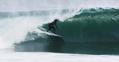 Irish professional surfer Conor Maguire pulls into a left-hand barrel somewhere in Ireland in April of 2018.