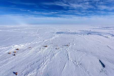 Tourists from the 50 Let Pobody cruise ship explore the area around the geographic North Pole.