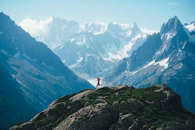 Ryan Sandes runs with dramatic mountains behind him in Chamonix, France.
