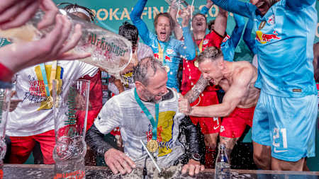 Marco Rose grabs a shower at the press conference