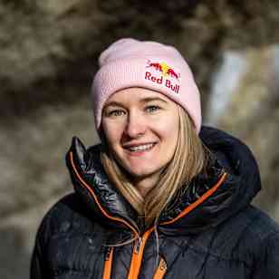 In November 2025, Red Bull athlete Shauna Coxsey is captured outdoors in Ticino, Switzerland, showcasing her signature adventure-ready look and a Red Bull beanie.