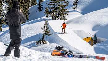 Freeskier Paddy Graham tests a kicker he's built in the backcountry.