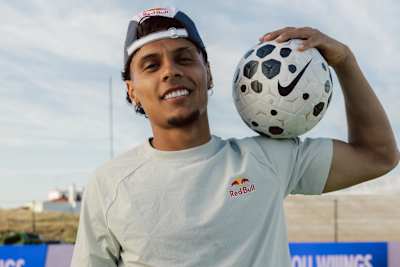 Richard Ríos poses with a football on his shoulder on a pitch in Colombia in April 2026.
